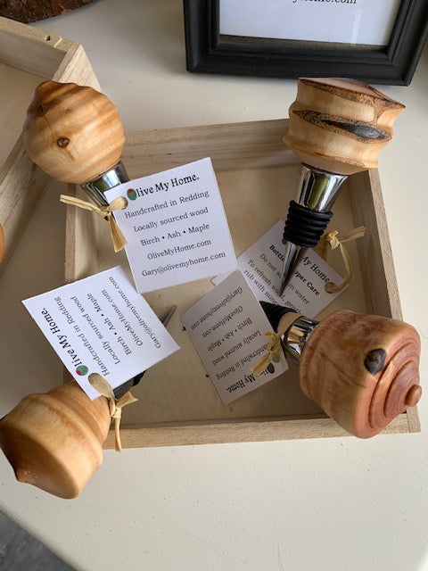 hand carved wooden bottle stopper. wood, stainless steel, rubber gasket