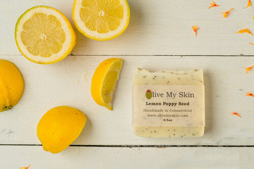 Lemon poppyseed soap with lemons in background